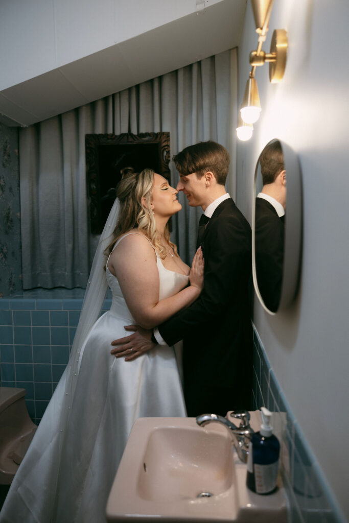 Bride and groom posing in the bathroom at Sure Thing Chapel in Las Vegas