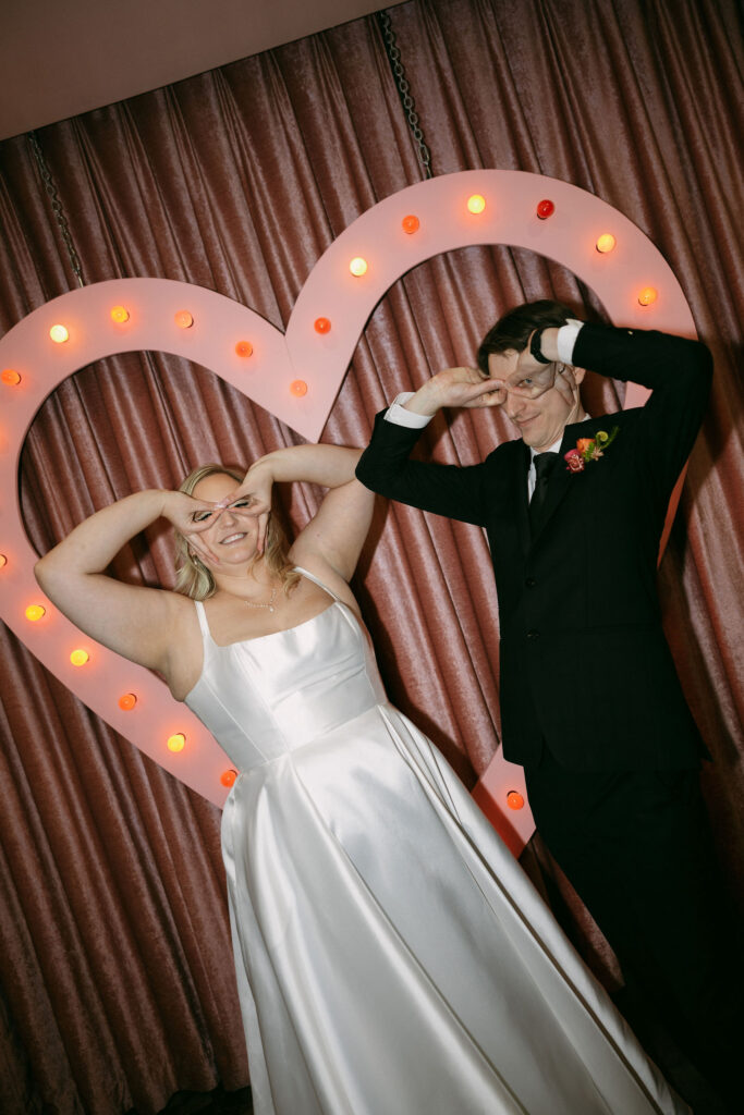 Bride and groom making a funny pose for their elopement photos