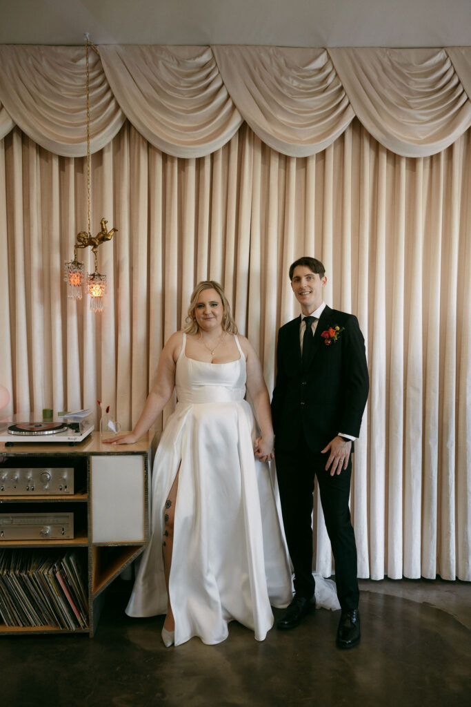 Bride and groom posing at Sure Thing Chapel
