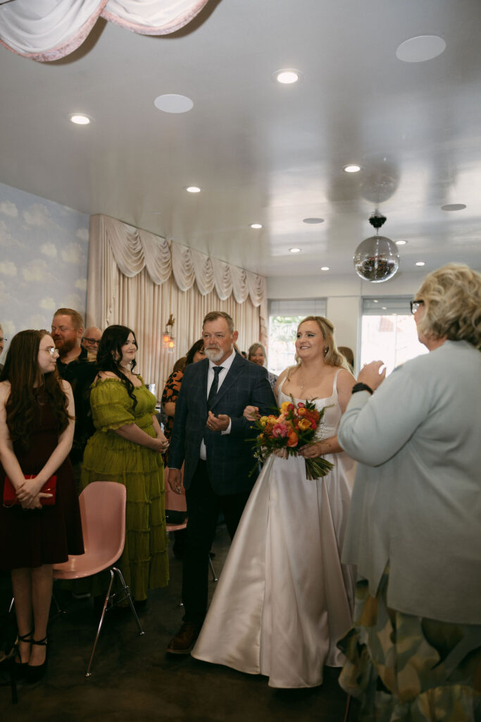 Bride walking down the aisle with her father