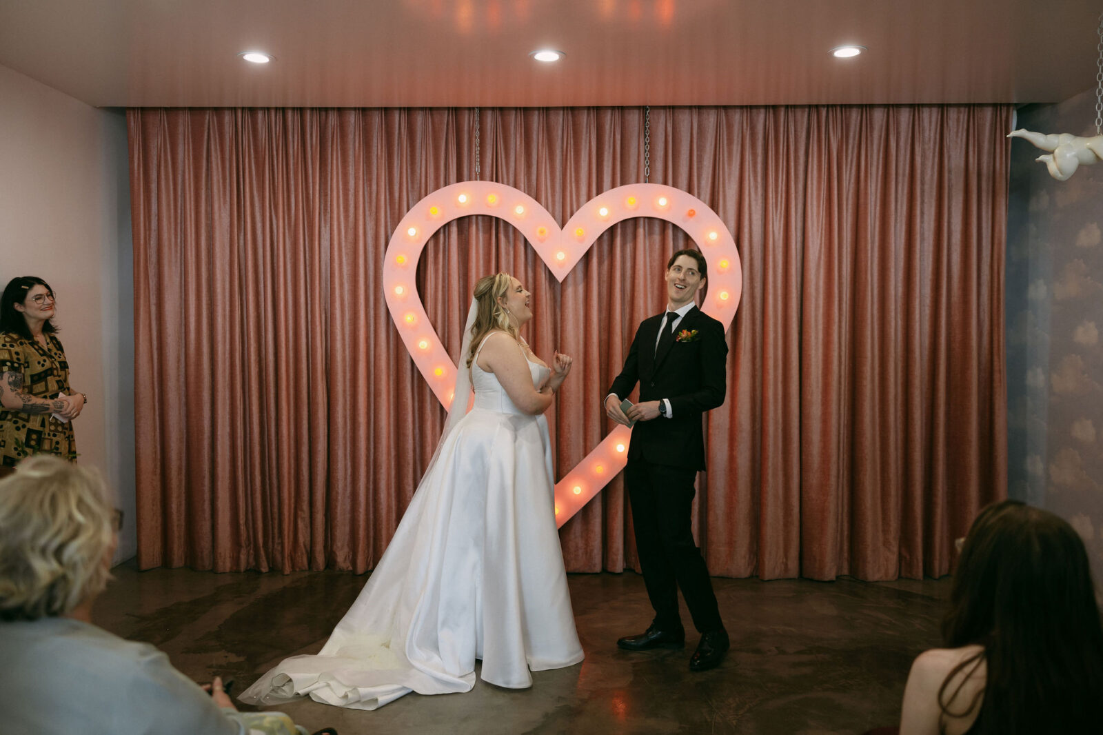 Bride and groom laughing during their wedding vows 