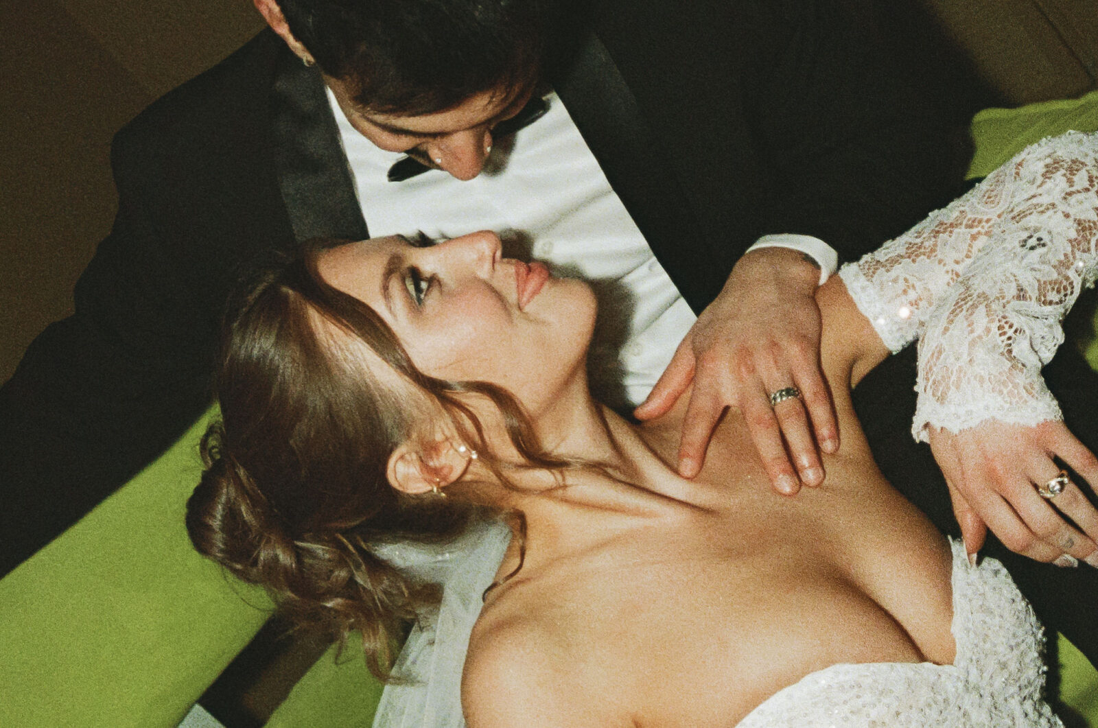 Close up shot of a bride and groom smiling at each other for their vintage retro film elopement in Las Vegas