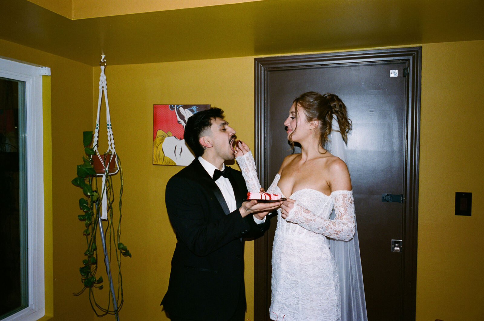 Bride feeding the groom some of their elopement cake