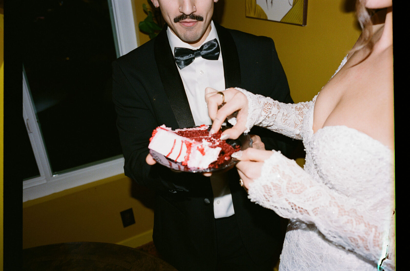 Bride and groom digging into their Las Vegas elopement cake