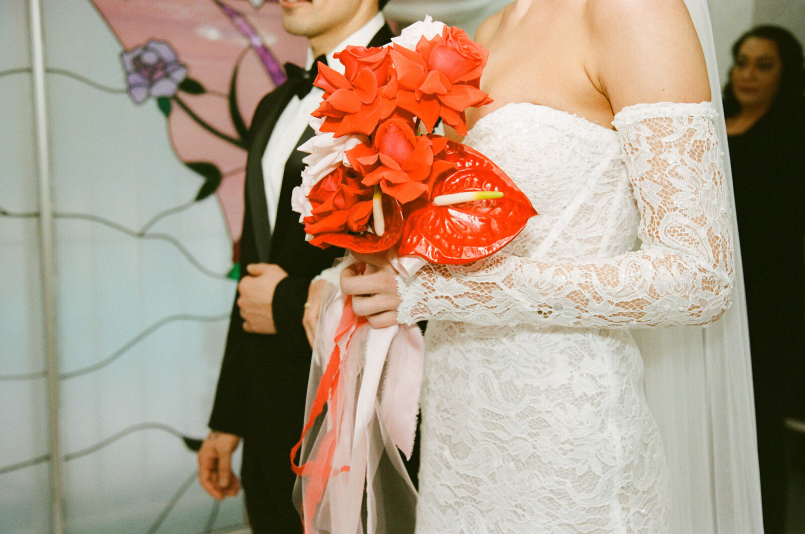 Close up film shot of a bride and groom standing at the altar during their Little White Wedding Chapel ceremony
