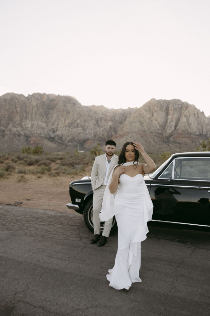 Couples Red Rock Canyon engagement photos in Las Vegas with classic Rolls Royce