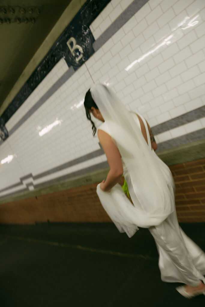 Bride walking through the subway.