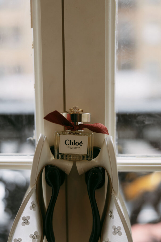 Brides perfume and heels hanging off the door handles at The Hotel Chelsea.