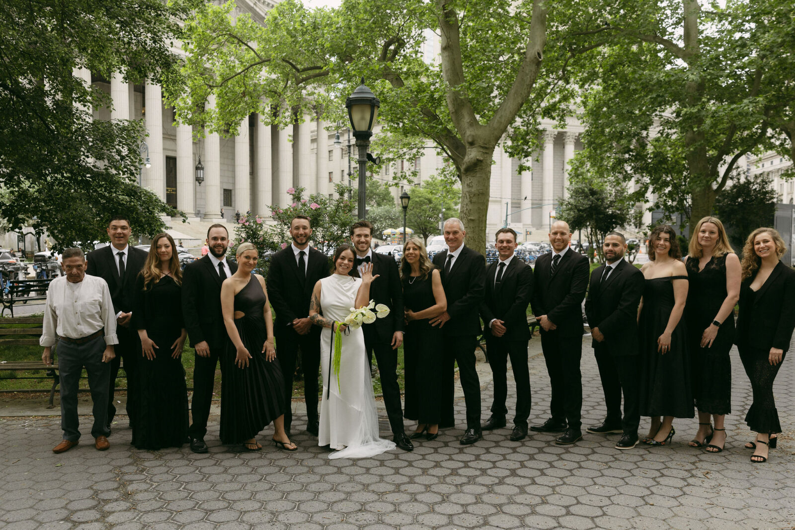 Group portrait with family and friends after a New York City Hall elopement in lower Manhattan.