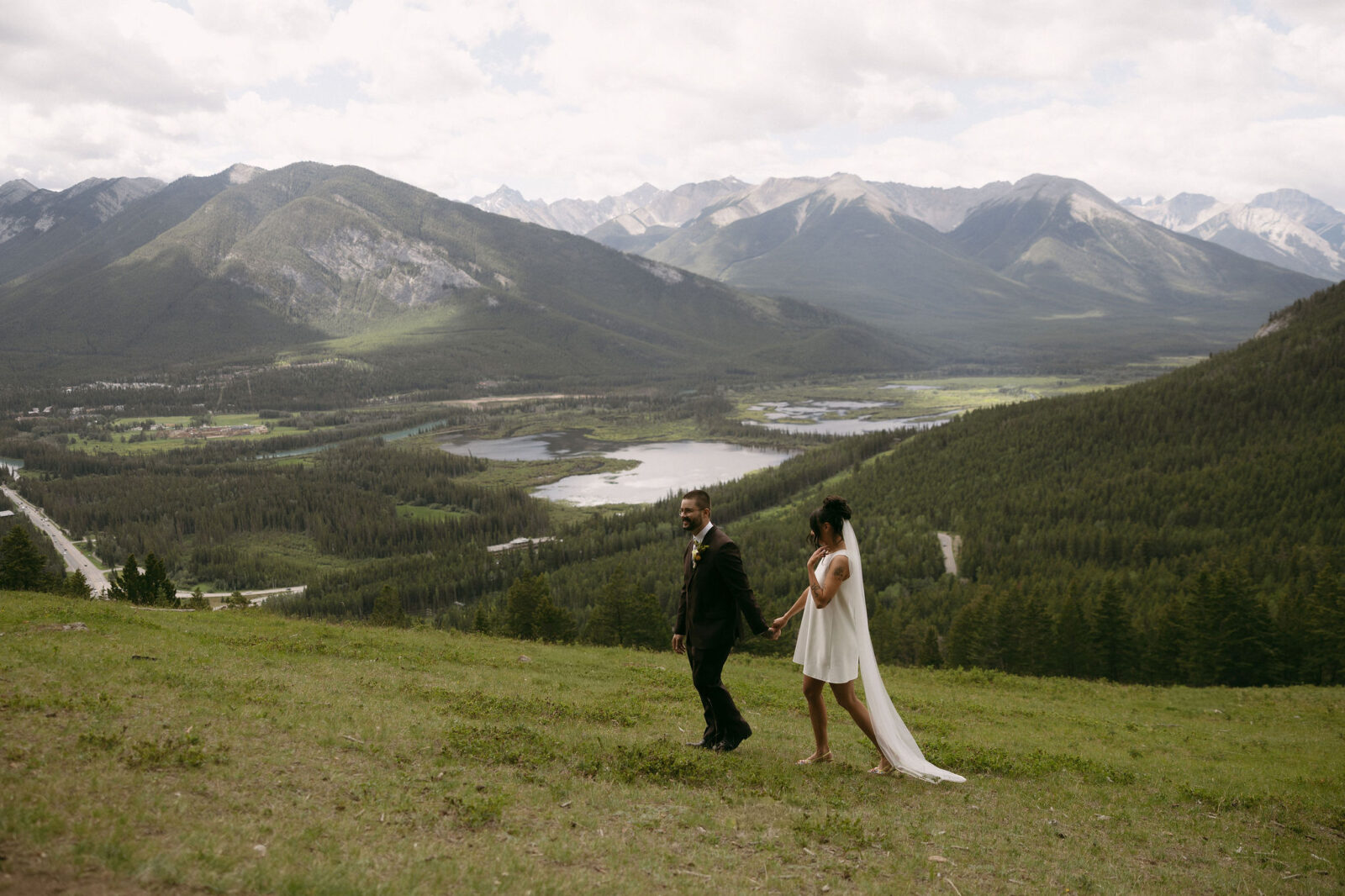 Couple walking in Banff National Park during their intimate elopement.