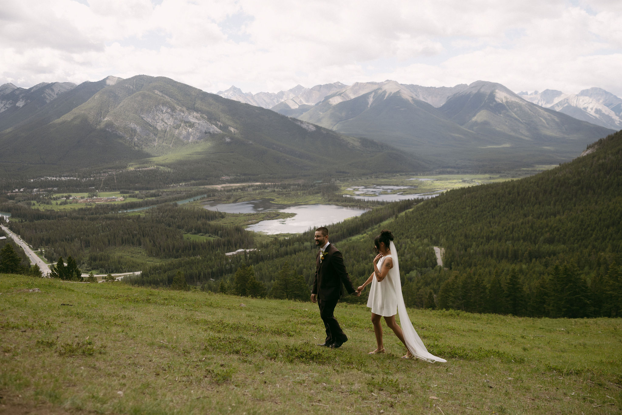 Couple walking in Banff National Park during their intimate elopement.