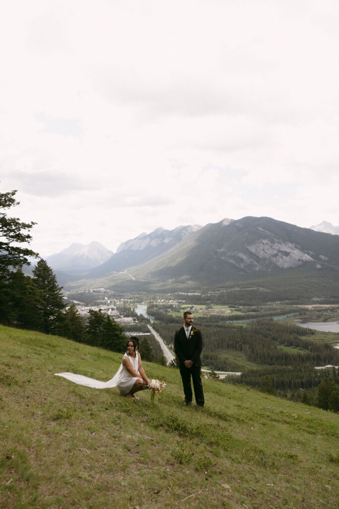 Bride and groom posing for their Banff National Park elopement photos.
