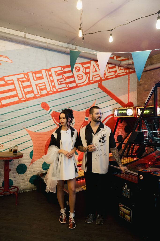 Bride and groom posing at High Rollers
