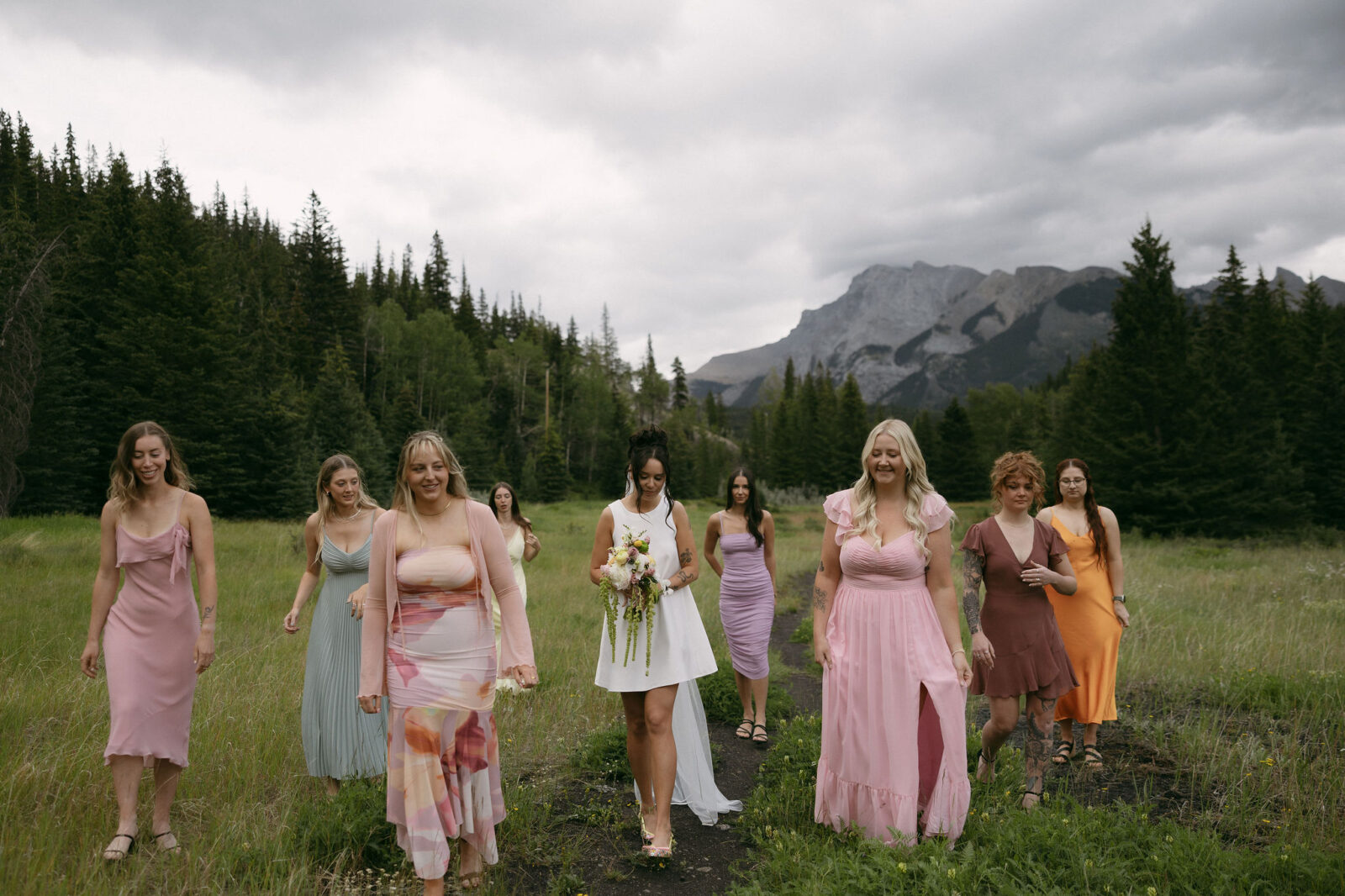 Bride and friends walking in Banff National Park.