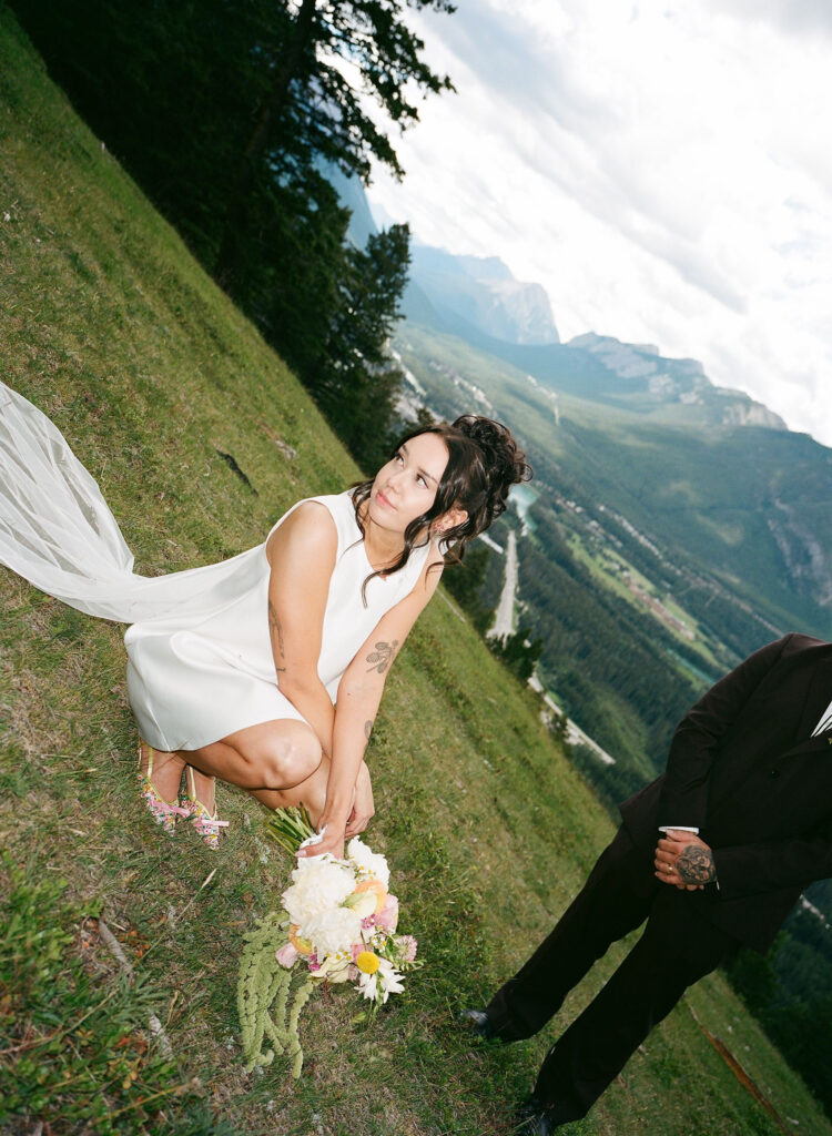 Film photo of a bride and groom posing in Banff National Park