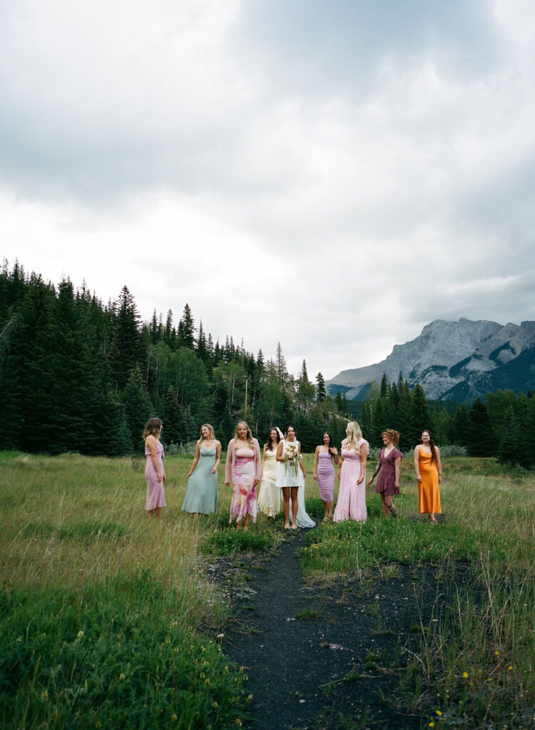 Bride and friends posing on film in Banff